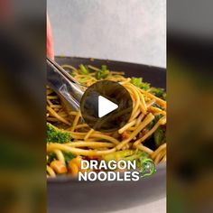 a plate of noodles with broccoli and carrots on it is featured in the video dragon noodles