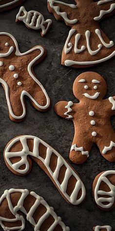 gingerbread cookies with icing on a baking sheet