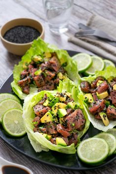 three lettuce wraps filled with meat and garnished with pineapple slices