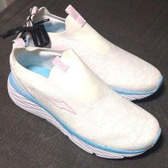 These Are A Women's Size 9 Sneakers. Very Comfortable And Brand New. White Shoe With Blue Trim. Very Pretty White Slip-on Running Shoes For Light Exercise, White Slip-on Comfortable Running Shoes, White Running Shoes With Round Toe For Summer, White Slip-on Running Shoes With Ortholite Insole, Comfortable Slip-on White Running Shoes, Casual Light Blue Running Shoes With Round Toe, White Slip-on Running Shoes For Summer, Comfortable White Running Shoes For Spring, Casual White Running Shoes With Ortholite Insole