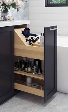 an open cabinet in the corner of a bathroom