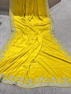 zarkan heavy hand crafted pure crepe silk saree in yellow. It is an exclusive heavy wedding party wear saree. comes with pre stitched blouse Embroidered Silk Blouse Piece In Yellow, Yellow Embroidered Silk Blouse Piece, Wedding Saree In Katan Silk With Dabka Work, Wedding Katan Silk Saree With Dabka Work, Wedding Saree With Dabka Work In Katan Silk, Embroidered Yellow Pre-draped Saree For Diwali, Yellow Embroidered Pre-draped Saree, Yellow Semi-stitched Pre-draped Saree With Resham Embroidery, Yellow Silk Blouse Piece For Navratri