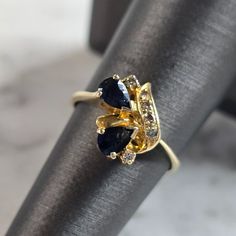 A Womens 14k Yellow Gold Ring With Blue Sapphires And Diamonds. The Ring Weighs 2.5g, And Is A Size 6.25. The Face Of The Ring Measures About 1/2". Any Questions Please Do Not Hesitate To Ask. Be Sure To Check Out Some Of My Other Great Items Up For Sale. Thank You. Teardrop Sapphire Ring In Yellow Gold For Anniversary, Yellow Gold Teardrop Sapphire Ring For Anniversary, Teardrop Yellow Gold Sapphire Ring For Anniversary, Pear-shaped Blue 14k Gold Ring, Anniversary Yellow Gold Teardrop Sapphire Ring, Blue Pear-shaped 14k Gold Ring, Fine Jewelry Yellow Gold Sapphire Ring Pear-shaped, Fine Jewelry Yellow Gold Pear-shaped Sapphire Ring, Yellow Gold Pear-shaped Sapphire Ring