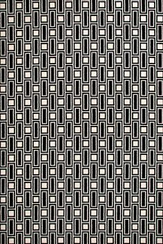 a black and white rug with squares on it