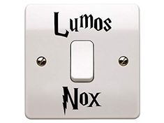 a white light switch with the words lumos and nox on it's side