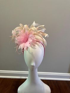 Light pink flower feather with cream curled feathers Elegant Feather Trim Fascinator For Spring, Chic Pink Fascinator For Spring, Spring Ostrich Feather Fascinator With Feather Trim, Cream Feathered Fascinator For Spring, Pink Feathered Fascinator For Kentucky Derby, Summer Pink Fascinator With Feathers, Spring Ostrich Feather Trim Fascinator, Pink Summer Fascinator With Feathers, Elegant Pink Ostrich Feather Fascinator