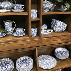 blue and white china on display in a store