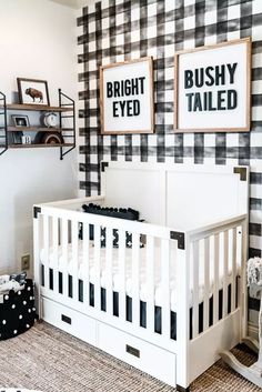 a baby's room decorated in black and white