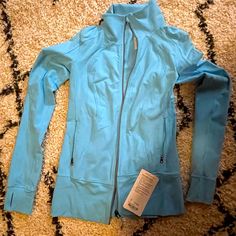 Lululemon Nice Asana Jacket In A Light Blue. New With Tags. Functional Blue Outerwear For Workout, Blue Winter Workout Track Jacket, Blue Spring Outerwear For Workout, Blue Spring Workout Outerwear, Spring Workout Blue Outerwear, Blue Long Sleeve Workout Track Jacket, Lululemon Rain Jacket, Lululemon Hoodie, Lululemon Scuba Hoodie