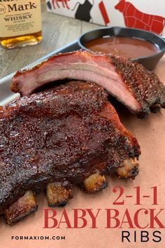 two baby back ribs sitting on top of a table