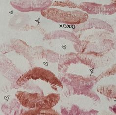 an image of some pink and red lips on white paper with black writing that says oxox