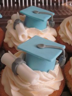 cupcakes with frosting and graduation caps on them