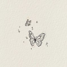 two butterflies flying in the air with stars around them on a white background, one is drawn