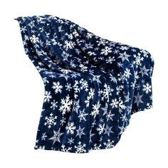 a blue and white blanket with snowflakes on the bottom is folded up in front of a white background