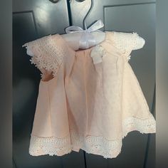 Adorable Baby Dress 6-9 Months Never Worn. Peachy Pink Color. Great For Easter! Buttons On Back And The Lace Detail Are So Cute! Cotton, Lace, Pearl Buttons, Pleated. Smoke Free, Pet Free Home! Cute Sleeveless Baptism Dress For First Birthday, Fitted Sleeveless Pink Baptism Dress, Cute Baptism Dress With Lace Trim, Cute Baptism Dress With Lace Trim For Formal Occasion, Pink Baptism Dress For Spring, Cute Lace Trim Baptism Dress For Formal Occasions, Cute Spring Baptism Dress, Cute Sleeveless Baptism Dress With Ruffles, Pink Cotton Dress For First Birthday