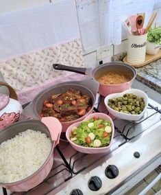 several bowls of food are sitting on the stove