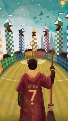 a harry potter movie poster with a boy holding a broom in front of a stadium