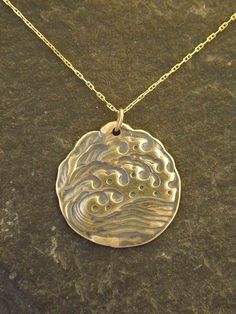 "The Wave pendant is 14K Gold. You may choose a 16\", 18\" or 20\" 14K Gold Chain as pictured. This Wave pendant measures 1\" in diameter. I hand cast all my pieces using the lost wax casting method. Please ask your needs. You may call me with questions, often I am out so please use my machine. 831-476-3176. Satisfaction Guaranteed! This piece is made and ready to ship This piece ships USPS First Class Insured I send items USPS First Class unless otherwise directed. I send as soon as I can, usua Engraved Bronze 14k Gold Necklaces, Artisan Engraved Yellow Gold Necklace, Handmade Custom Necklace In Yellow Gold, Artisan Necklace With Round Pendant, Cast Jewelry, Gold Medallion Jewelry Hand Cast, Artisan Hand Cast Necklace With Round Pendant, Gold Medallion Hand Cast Jewelry, Bronze Hand Cast Round Pendant Necklace