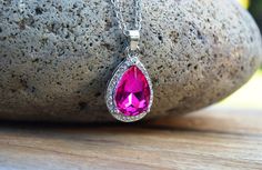 "This realistic, beautiful Sofia amulet necklace is a dark pink/magenta; perfect since her amulet has permanently turned such in 2016. Looking for the exact one in purple? It's right here: https://www.etsy.com/listing/239579086/sofias-amulet-princess-necklace-purple Or perhaps Princess Sofia's tiara? https://www.etsy.com/listing/692006113/sofia-tiara-princess-sofia-costume This adult-grade necklace is NOT like the other shops here with a with the plastic rhinestone glued in the center (the amule Sofia Amulet, Sofia Costume, Evil Princess, Princess Necklace, Amulet Necklace, Princess Outfits, Disney Jewelry, Bridesmaid Necklace, Teardrop Necklace