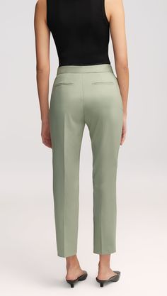 Made of a year-round, refined Italian Seasonless Wool, this slim fitting trouser features a contoured waistband and an ankle length inseam. The lightweight fabric is naturally temperature regulating and odor and wrinkle resistant. Functional details include a hidden exterior credit card pocket, front side pockets and back welt pockets. Classic Fitted Pants With Seam Detailing, Fitted Pants With Seam Detailing For Spring, Classic Straight Silhouette Pants For Spring, Formal Straight Silhouette Bottoms For Spring, Formal Spring Bottoms With Straight Silhouette, Elegant Straight Silhouette Pants For Spring, Fitted Bottoms With Straight Silhouette For Spring, Elegant Mid-rise Bottoms With 4-way Stretch, Spring Bottoms With Concealed Placket And Tapered Leg