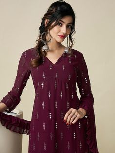 Burgundy embroidered Kurta with Palazzos with dupattaKurta design:Ethnic motifs embroideredA-line shapeRegular styleV-neck, three-quarter regular sleevesNa pockets sequinned detailKnee length length with straight hemGeorgette machine weave fabricPalazzos design:Solid PalazzosPartially elasticated waistbandSlip-on closure V-neck Anarkali Set For Diwali, Georgette V-neck Sets For Navratri, V-neck Georgette Sets For Navratri, Eid V-neck Sets With Zari Work, Festive Chanderi Salwar Kameez With V-neck, Georgette Blouse Piece V-neck For Designer Wear, V-neck Anarkali Set With Dupatta, Georgette V-neck Blouse With Zari Work, V-neck Traditional Wear With Zari Work For Diwali