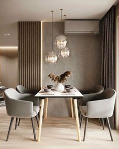 a dining room table with chairs and a vase on it in front of a wall