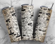 three harry potter tumblers on a marble surface