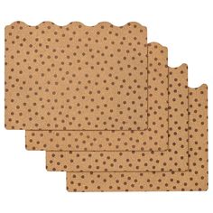 four placemats with brown polka dots on them