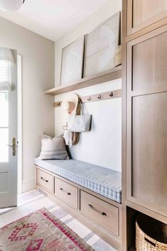 the cover of rachel harchel's mudroom, featuring a bench with pillows and hats on it