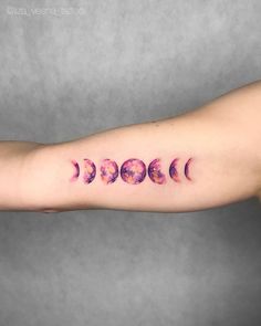 a woman's arm with five phases of the moon tattoo on her left arm