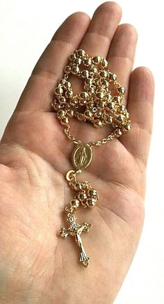 "18k gold over 925 sterling silver italian rosary 24\" long . for protection and good luck made in italy 5 mm beads gr:26.2 rosario de 925 plata esterlina con 18k bano de oro 24\" largo . para proteccion y buena suerte . hecho en italia 5 mm beads gr: 26.2" Gold Round Beads Rosary As Gift, Gold Rosary With Round Beads As Gift, Elegant Gold Rosary As Gift, Elegant Gold Rosary For Gift, Gold Necklaces With 8mm Beads For Spiritual Style, Gold Crucifix Necklace With 8mm Beads, Gold Necklace With Miraculous Medal And Round Beads, Gold Spiritual Rosary Bracelet With Polished Beads, Yellow Gold Rosary With Round Beads