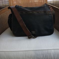 Beautiful Vachetta Men's Messenger Bag In Black And Dark Brown, Has Aged Super Well And Was Just Professionally Cleaned. The Bag Shows Very Little Wear On The Shoulder Strap And The Bag Lining Is Perfectly Clean. Perfect For Every Day Wear And This Type Of Leather Becomes More Luxurious Over Time. Brown Coated Canvas Saddle Bag For Travel, Luxury Everyday Carry Shoulder Bag, Brown Coated Canvas Saddle Bag For Everyday Use, Brown Leather-lined Camera Shoulder Bag, Rectangular Coated Canvas Shoulder Bag With Leather Backing, Everyday Leather Trim Shoulder Bag, Black Shoulder Bag With Leather Lining And Coated Canvas, Travel Coated Canvas Satchel Saddle Bag, Leather Trim Shoulder Bag For Everyday Carry