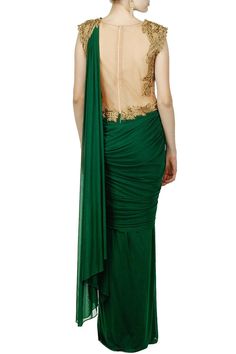 This saree gown is in green colour in lycra fabric. This saree gown is pre draped with zari embroidered bodice. The tummy part is in transparent net. This saree gown is available Made to Measure. This product will be shipped to you after 3-4 weeks from the date of order placed. Green Pre-draped Saree With Sheer Dupatta For Evening, Fitted Draped Gown With Sheer Dupatta, Designer Draped Gown With Sheer Dupatta, Fitted Georgette Gown With Sheer Bodice, Green Pre-draped Saree With Unstitched Blouse, Green Floor-length Pre-draped Saree With Unstitched Blouse, Green Draped Lehenga With Zari Work, Green Lehenga With Traditional Drape For Evening, Green Lehenga With Sheer Dupatta For Evening