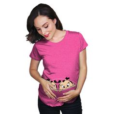 a woman is holding her stomach while wearing a t - shirt