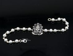 This amazing silver Rakhi crafted from 925 silver with immense precision. It exudes excellent craftsmanship and will surely look wonderful on your brother's wrist. handmade custom design God divine Bracelet Or Rakhi bracelet with silver, rudraksha and silver beaded chain, this is special design beaded bracelet we can use either Rakhi bracelet or daily use bracelet for unisex. Best Rakshabandhan Festival best wishes sibling gift for your brother and sister's , Metal-925 sterling silver. Item type Silver Beaded Bracelets With Round Beads For Festivals, Spiritual Sterling Silver Bracelet With Oxidized Finish, Spiritual Oxidized Sterling Silver Bracelet, Symbolic Silver Jewelry With Round Beads, Sterling Silver Polished Beads Bracelet As Gift, Silver Bracelets With Polished Beads For Gifts, Sterling Silver Bracelet With Polished Beads As Gift, Polished Beads Sterling Silver Bracelet Gift, Handmade Sterling Silver Rosary Bracelet