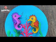 a paper plate with two seahorses on it