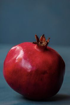 a red apple sitting on top of a table