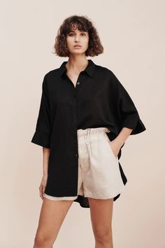 LULA SHIRT - BLACK – THE POSSE US Oversized Cotton Shirt In Effortless Style, Oversized Cotton Blouse With Rolled Sleeves, Black Linen Shirt For Spring, Chic Linen Shirt With Shirttail Hem, Black Shirttail Hem Blouse For Summer, Oversized Summer Blouse With Rolled Sleeves, Oversized Summer Shirt With Rolled Sleeves, Oversized Blouse With Rolled Sleeves For Summer, Relaxed Fit Linen Blouse With Shirttail Hem