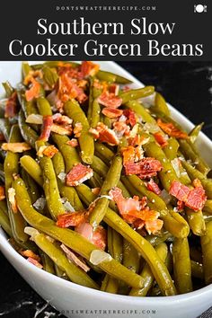 southern slow cooker green beans in a white bowl with bacon on top and text overlay that reads southern slow cooker green beans