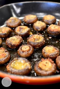 some food is cooking in a skillet on the stove top and ready to be eaten