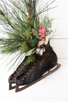 Vintage/Antique pair of rustic and rusty ice skates filled with faux greens and frosted berries. Jingle bells add a little sparkle! Hangs with black and white buffalo check wire ribbon. Perfect for Christmas or Winter decor. Hang on wall or door, place on shelf or mantle, or use on your porch! (Berries may need to be kept out of snow/rain). Entire piece measures about 12" wide by 20" tall (with greens). (Skate leather is old and may have some peeling.) Blanket not included. Decorating With Ice Skates, Vintage Ice Skates, Frosted Berries, Christmas Winter Decor, 2025 Christmas, Vintage Ice Skating, Christmas Ice Skates