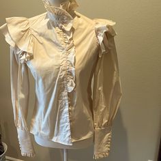 Hunters Run Vintage Blouse With Ruffled Neck, Front, And Sleeves Small Size 3. Off White Nwt Never Worn Wide Cuffs With Ruffled Edge Buttons With Fabric Loops. Old West Flavor Formal Cream Cotton Top, Cream Cotton Top For Formal Occasions, Fitted Cream Shirt, Formal Tops With Ruffles And Collar, Formal Ruffled Collar Top, Formal Fitted Ruffle Tops, Formal Fitted Top With Ruffle Sleeves, Fitted Cream Shirt For Fall, Classic Fitted Blouse With Ruffles