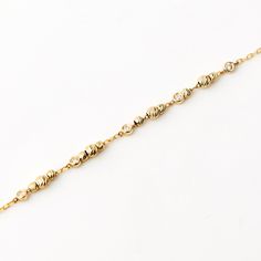 Diamond Ball Bead Station 14K Gold Bracelet Inspiring elegance with every sparkle, the Diamond Ball Bead Station Bracelet in 14K Solid Gold is the epitome of luxury. This dainty ball beaded chain bracelet with bezel diamond is a statement piece, intricately crafted for an undeniable charm. Perfect as a 14k gold Jewelry gift for her, it's an irresistible blend of sophistication and style, designed to enhance any outfit. This timeless piece is not just a bracelet, but a token of love, making it a Beaded Chain Bracelet, Diamond Ball, Gold Jewelry Gift, Station Bracelet, Bezel Diamond, Perfect Gift For Her, Beaded Chain, Chain Styles, Jewelry Branding