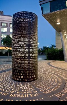 a large metal object sitting on top of a sidewalk