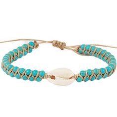 The Reef Break Cowry Shell cuff bracelet is a perfect addition to your favorite summer stack. Made with a cotton cord, natural cowry shell, and adjustable sliding string closure for a perfect fit. Colors: White, Turquoise Materials: Natural Cowry Shell, Imitation Turquoise, and Adjustable Cotton Cord Size: One Size, Adjustable Sliding String Closure Handmade by female artisans in Thailand. Shell Bracelets With Sliding Knot For Beach, Beach Bracelets With Sliding Knot And Shell Material, Beach Shell Bracelets With Sliding Knot, Adjustable Shell Bracelets For Beach Season, Bohemian Shell Friendship Bracelets For Vacation, Casual Cowrie Shell Bracelets For Vacation, Casual Cowrie Shell Bracelets, Casual Shell Bracelets For Beach Season, Bohemian Shell Friendship Bracelets