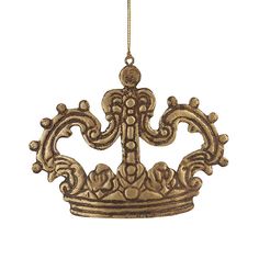 a golden crown hanging from a gold chain