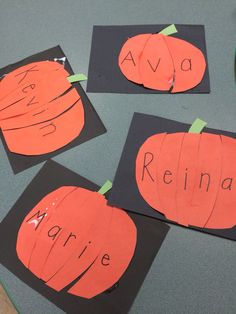 four pieces of paper cut out to look like pumpkins with the words ava, reina, arrie and avoca written on them