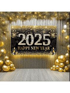 new year's eve party backdrop with gold balloons and streamers in the background