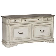 an old white dresser with two drawers