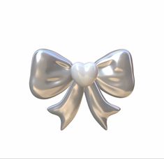 a silver bow with a pearl on it